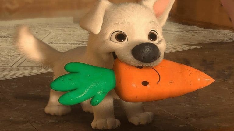 Hoofdpersonage van hondenfilm Bolt met wortel in zijn bek.